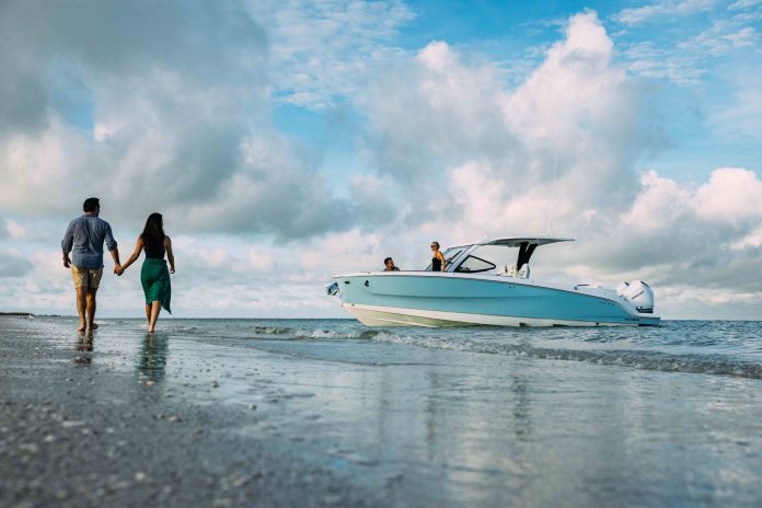 The Beneteau Flyer 30 sits just offshore, its shallow-water access making it easy to move between the boat and the beach. // Photo courtesy Beneteau
