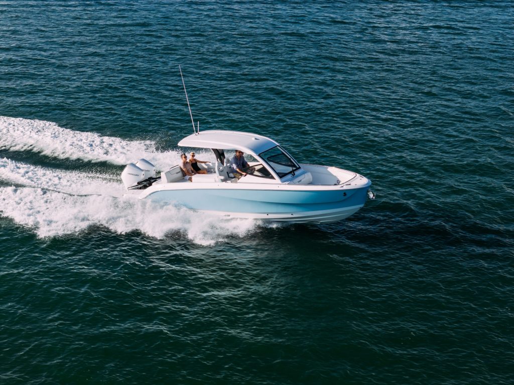 The Beneteau Flyer 30 underway, with its hardtop sheltering the helm and cockpit while leaving the bow open. // Photo courtesy Beneteau