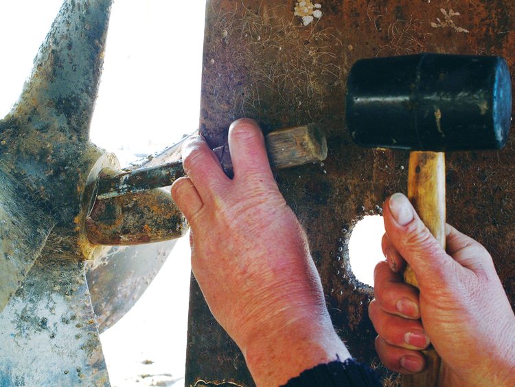 The first step in propeller removal is to knock back the tab washer (or remove the split spin as appropriate).