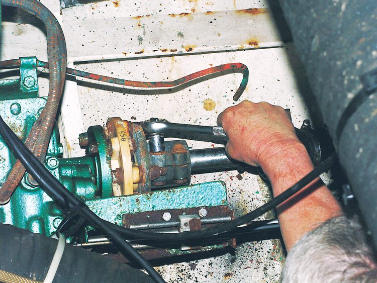 Disconnect the prop shaft coupling. This is a simple clamp type with four nuts and bolts.