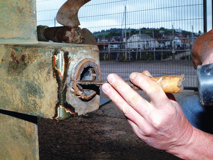 Remove the bearing grub screws. With phenolic-bodied bearings, simply break them up using a sharp wood chisel. For bronze-bodied bearings use an internal puller. If you have a GRP stern tube, use a puller made up from a threaded rod(s) and coupling nuts instead, or several nuts and a lathe-cut disk.