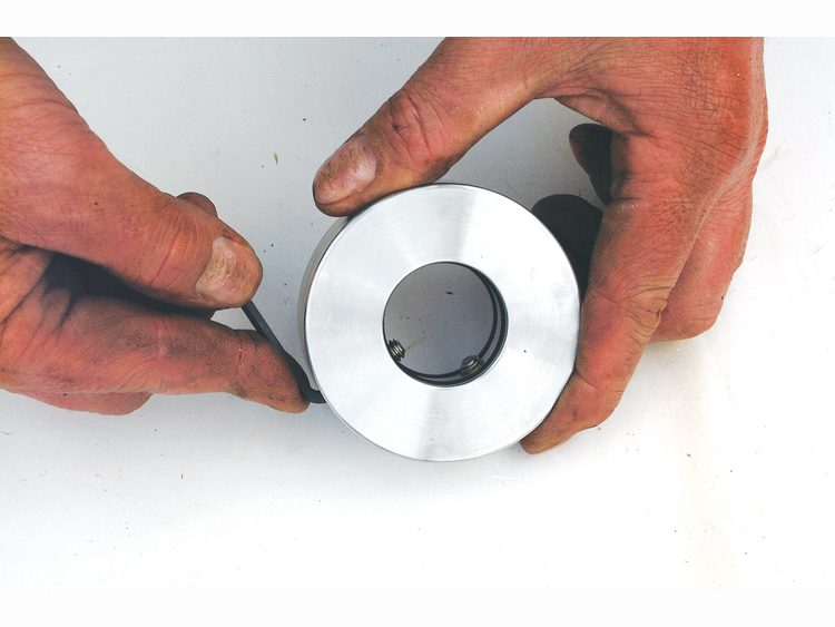Screw the grub screws into the rotor so that they protrude inside. This ensures any swarf in the threads is removed. Then wind them back so they don’t score the shaft during fitting.