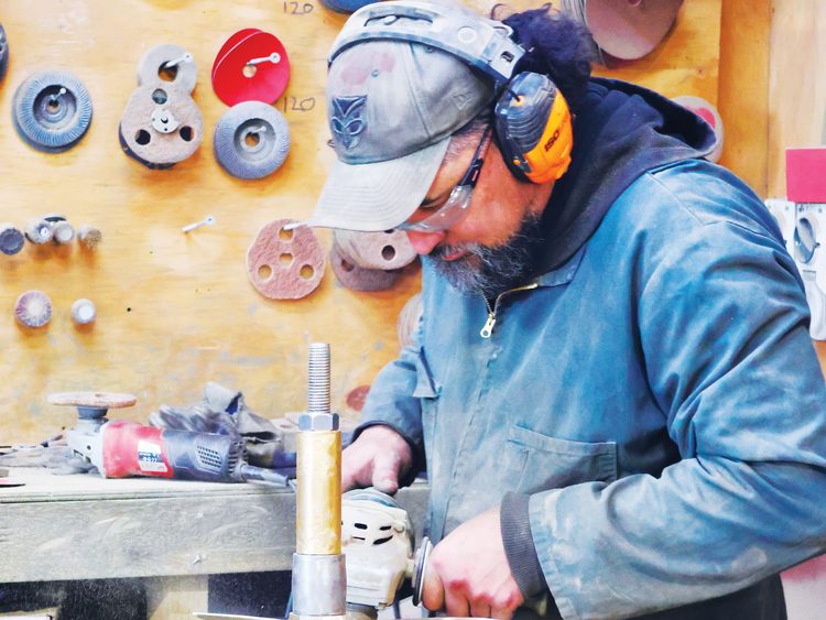 Finishing off a new propeller in traditional style; below, Bri-Ski Propellers rural premises at Maramarua.