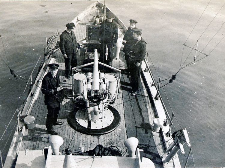 The foredeck. Drifting with hydrophones in action, 12 pounder gun, radio aerials rigged..