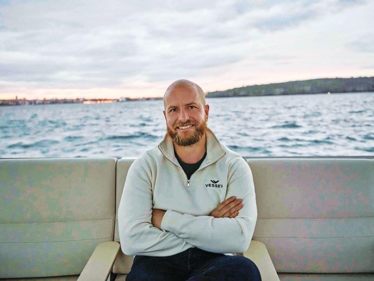 Vessev co-founder and CEO, Eric Laakmann, aboard Vessev’s VS–9 electric hydrofoiling passenger vessel. Photo credit Derek Henderson.