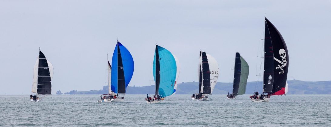 The fleet fan out across Waitemata Harbour as they edge their way up towards the top mark in the Gulf in the 2026 Roy McDell Memorial Cup.