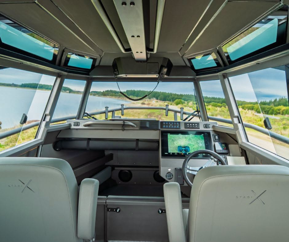 From the helm, the StabiX 250UCC opens aft into the cockpit, while the forward cabin provides a sheltered sleeping area for overnight trips. // Photo courtesy StabiX