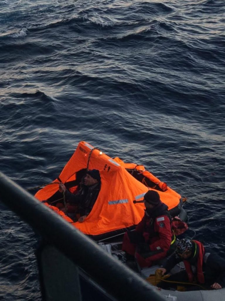The crew of Tai Tam are rescued after their boat sank due to a whale strike in the South Pacific. // Photo courtesy NDF