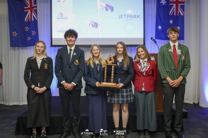 Representatives of New Zealand’s Nations Trophy winning schools, from left: Whangārei Girls’ High School, Auckland Grammar School, Nelson College for Girls, Macleans College, Westlake Girls High School and Westlake Boys High School. The Kiwi teams reclaimed the trophy at the 2026 JetPark Secondary Schools Interdominion Team Racing Championships. Photo: Insight Media.