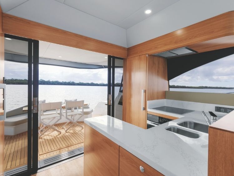 An entertainer’s galley aft and excellent flow to the outside. // Photo courtesy Maritimo